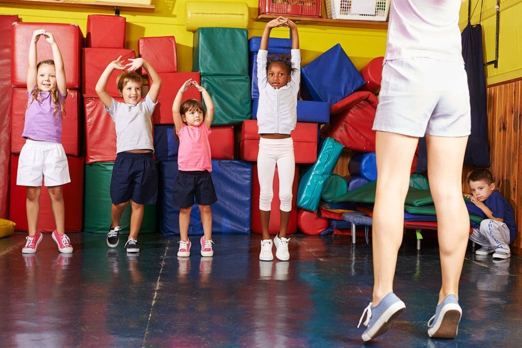 Kids stretching in preschool
